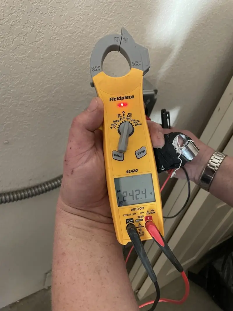 Voltage testing with clamp meter during Electrical Installation Services in Fort Valley